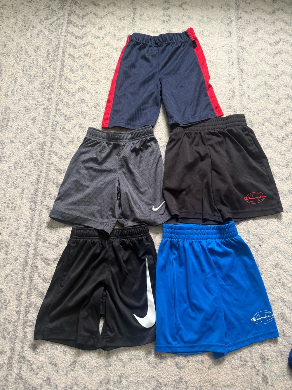 5 pairs of boys or girls shorts. Excellent condition. Nike and Champion.